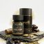 Hurrywell Extra Power Premium Shilajeet Capsules bottle with black premium packaging, gold capsules, and natural Ayurvedic ingredients displayed on a stone platform.